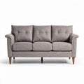 Three-seater sofa in gray fabric with tufted cushions and wooden legs