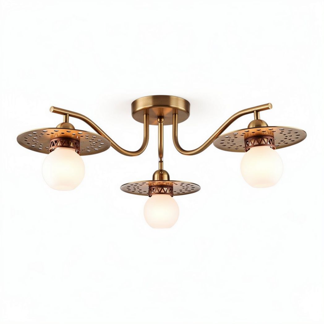 Three-light brass ceiling fixture with perforated shades and globes